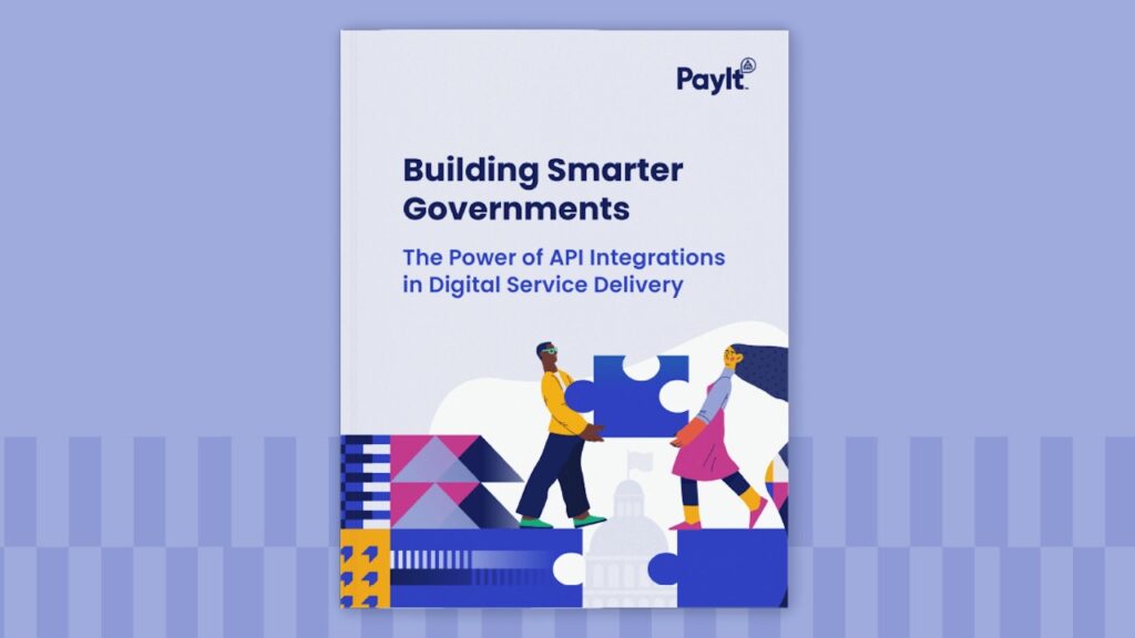 Cover image of a white paper titled “Building Smarter Governments: The Power of API Integrations in Digital Service Delivery,” published by PayIt. The design features two illustrated people connecting large puzzle pieces in front of a government building, symbolizing collaboration and integration. The background is primarily white with colorful geometric patterns at the bottom.
