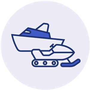 A recreational boat placed alongside a snowmobile 