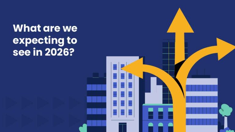 Graphic with the text ‘What are we expecting to see in 2026?’ alongside illustrated city buildings and three large yellow arrows branching upward.